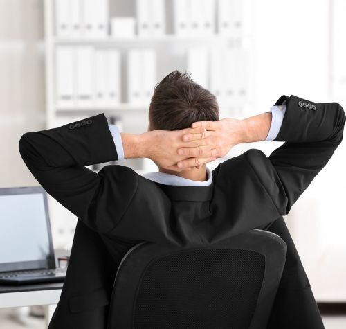 Man relaxing with his trading results